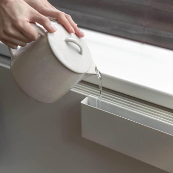 Radiator cover with water tray